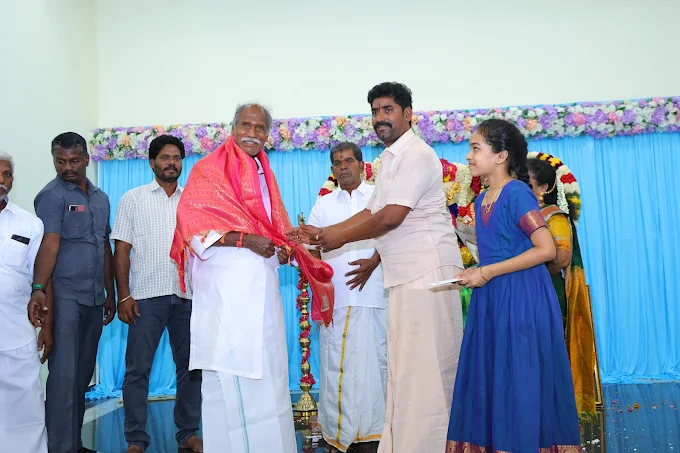 A traditional honouring ceremony taking place on the decorated stage