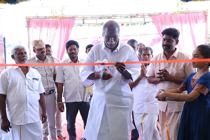 Guests gathered under the entrance canopy during a function