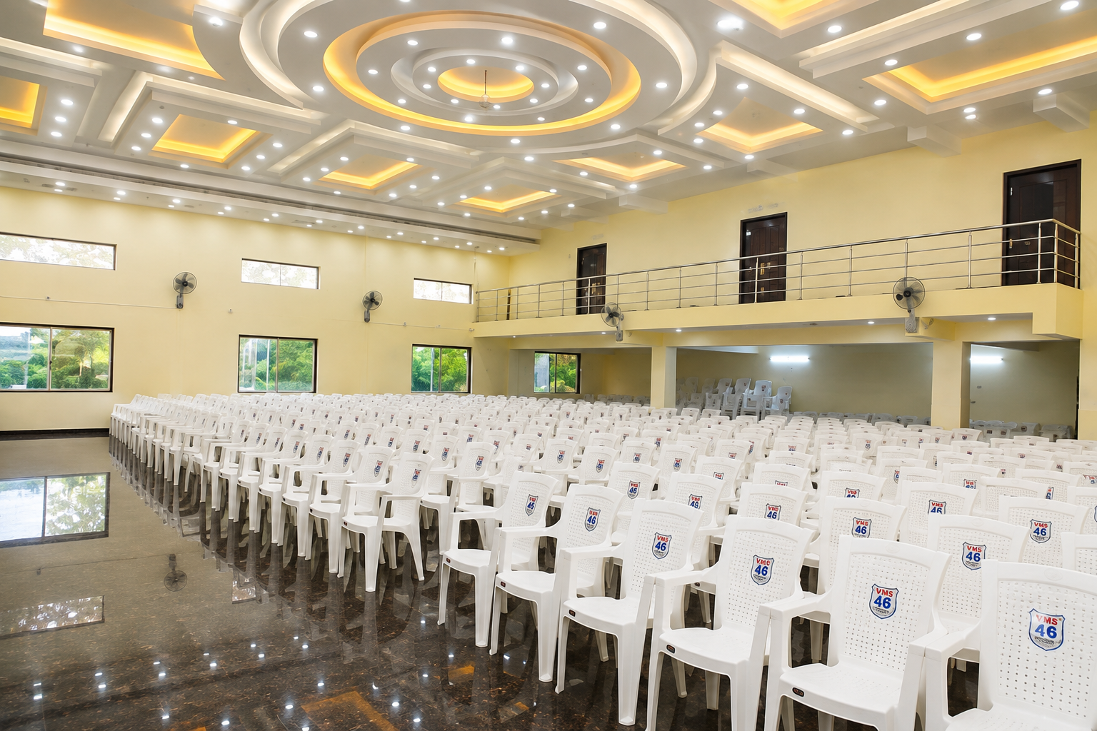 The main hall arranged with rows of white seating